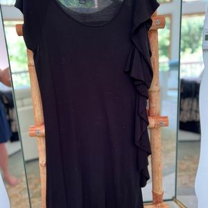 INC soft black sleeveless dress with ruffle side accent.